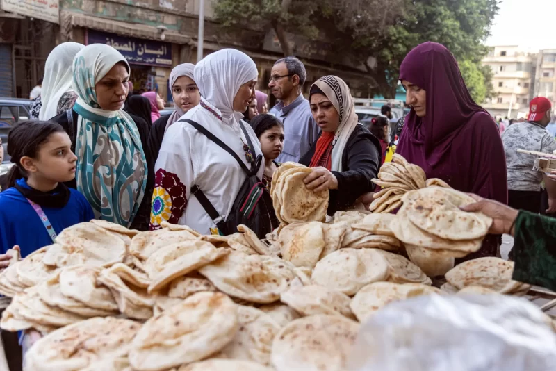 A line for bread in Cairo. Higher costs of food subsidies will further burden government spending in Egypt. Credit: Roger Anis/Getty Images