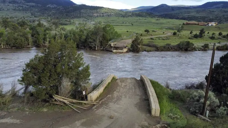 A washed out bridge shown along the Yellowstone River Wednesday, June 15, 2022, near Gardiner, Mont. Historic floodwaters that raged through Yellowstone National Park may have permanently altered the course of a popular fishing river and left the sweeping landscape forever changed.