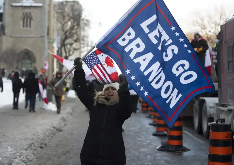 During the so-called freedom convoy in Ottawa, a person waves a 'Let's Go Brandon' flag, code for an expletive against US President Joe Biden used by supporters of former President Donald Trump. 